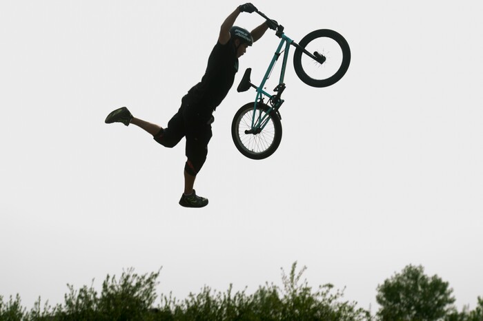 (Rick Egan  |  The Salt Lake Tribune)    Justin McCarty performs a trick in the air, during the BMX Stunt Show, at the Davis County Fair in Farmington, Saturday, Aug. 18, 2018.