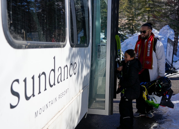 (Bethany Baker | The Salt Lake Tribune) People get onto the shuttle at Sundance Resort near Provo on Thursday, Dec. 14, 2023.