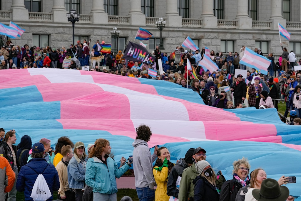 (Francisco Kjolseth | The Salt Lake Tribune) Hundreds of people show up at the Utah State Capitol on Mar. 29, 2025 to fly the largest transgender pride flag in Utah. The unveiling of the flag is part of celebrations for Transgender Day of Visibility, hosted by local nonprofits Utah Pride Center and The Glitter Foundation.