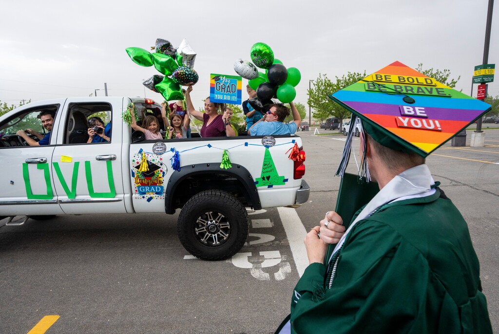 (Rick Egan | The Salt Lake Tribune). Family and friends cheer for UVU graduate, Jacinta Stephens, from Orem, during the Utah Valley University Drive-Through graduation in Orem, on Friday, May 7, 2021. New U.S. Census data shows an increase of 3% in college graduation rates for Utahns age 25 and older from 2021 through 2022.