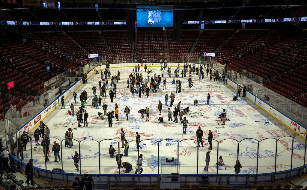 (Rick Egan | The Salt Lake Tribune) Fans write farewell messages on the ice after the last Utah Grizzlies game at the Maverik Center on Sunday, April 12, 2026.