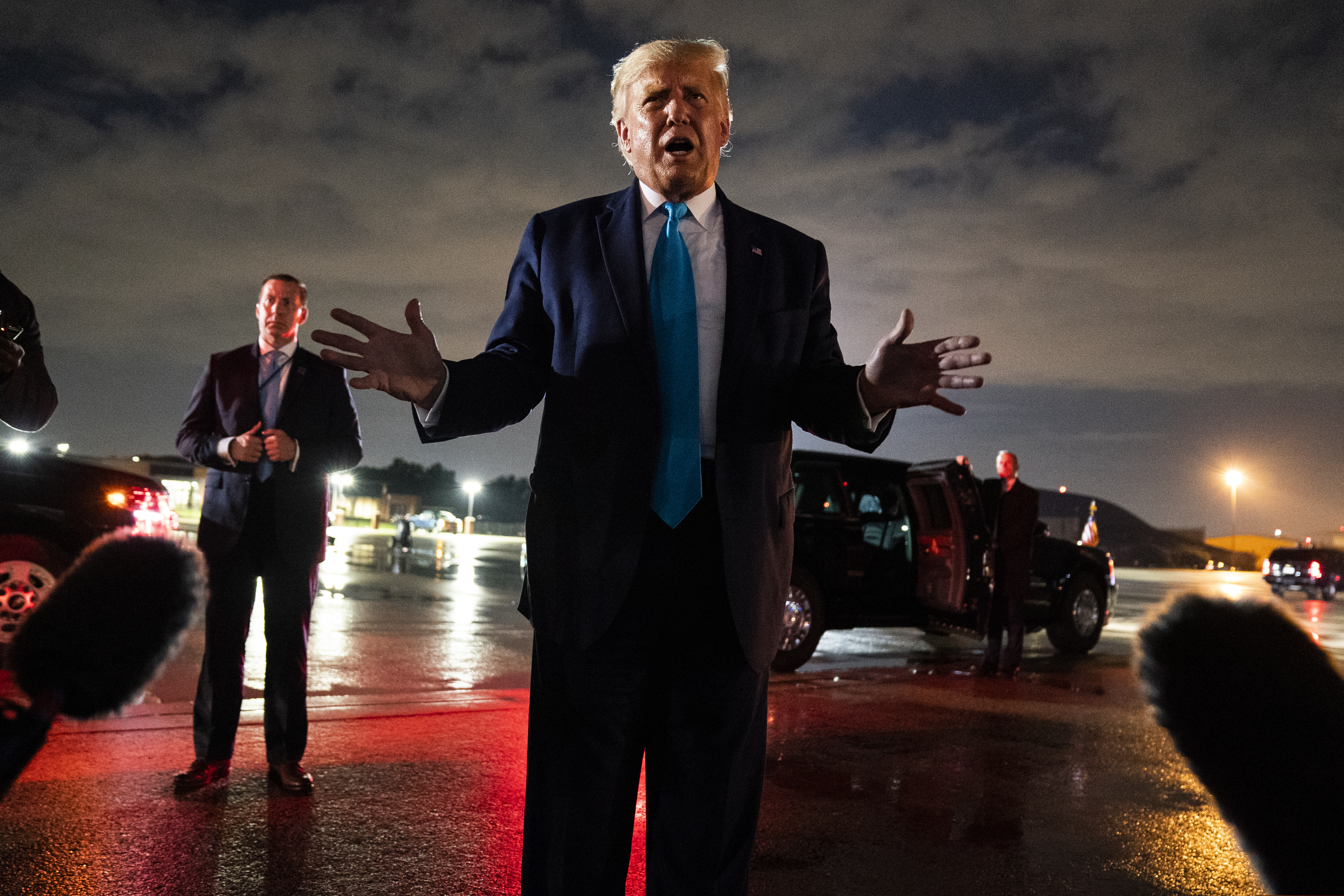 (Evan Vucci | The Associated Press) President Donald Trump talks with reporters at Andrews Air Force Base after attending a campaign rally in Latrobe, Pa., Thursday, Sept. 3, 2020, at Andrews Air Force Base, Md.