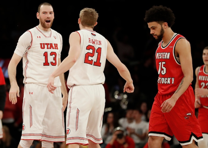 Utah forward Tyler Rawson (21) celebrates with forward David Collette (13) after hitting a 3-point shot against Western Kentucky during the second half of an NCAA college basketball game during the semifinals of the NIT, Tuesday, March 27, 2018, in New York. Utah won 69-64. (AP Photo/Julie Jacobson)