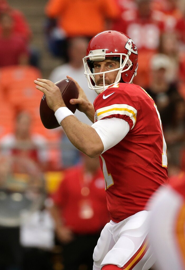 Kansas City Chiefs quarterback Alex Smith throws during the first half of a preseason NFL football game against the Tennessee Titans at Arrowhead Stadium in Kansas City, Mo., Friday, Aug. 28, 2015. (AP Photo/Charlie Riedel)