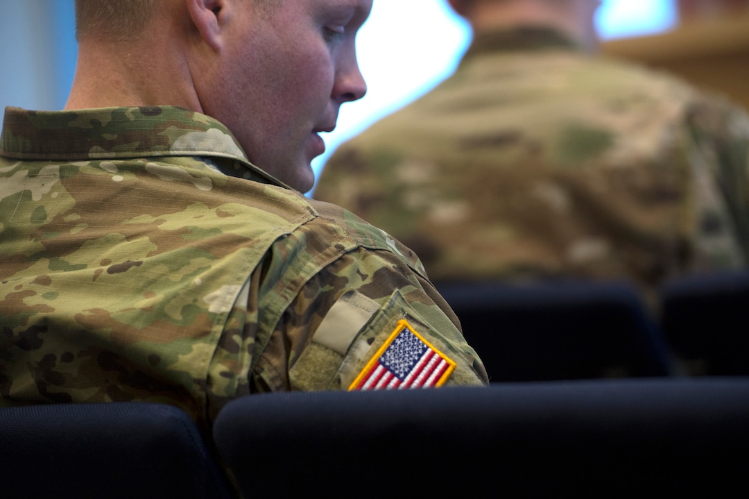 Scott Sommerdorf | The Salt Lake TribuneServicemen listen to a chaplain at the Camp Williams chapel, Sunday, March 4, 2018.