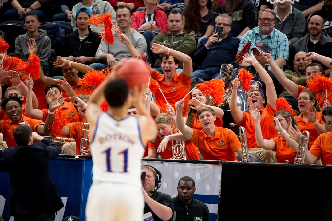 (Leah Hogsten  | The Salt Lake Tribune)  The Auburn band heckles Kansas Jayhawks guard Devon Dotson (11) as Auburn faces Kansas in the second round of the NCAA tournament in Salt Lake City on Saturday, March 23, 2019.