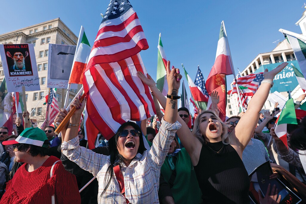 People who support the U.S. and Israel strikes on Iran, rally near the White House, Saturday Feb. 28, 2026, in Washington. (AP Photo/Jose Luis Magana)