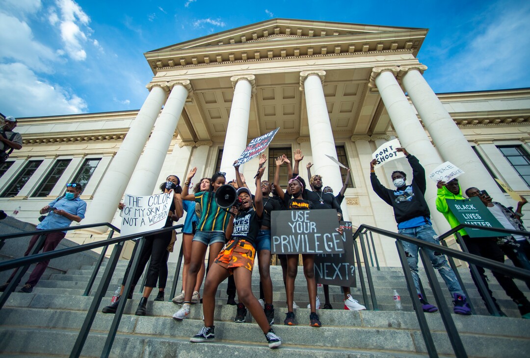 ((Rick Egan  |  The Salt Lake Tribune) Diane Bahati, leads the crowd as they chant in front of the Park Building at the University of Utah, during a demonstration on Wednesday, June 3, 2020.