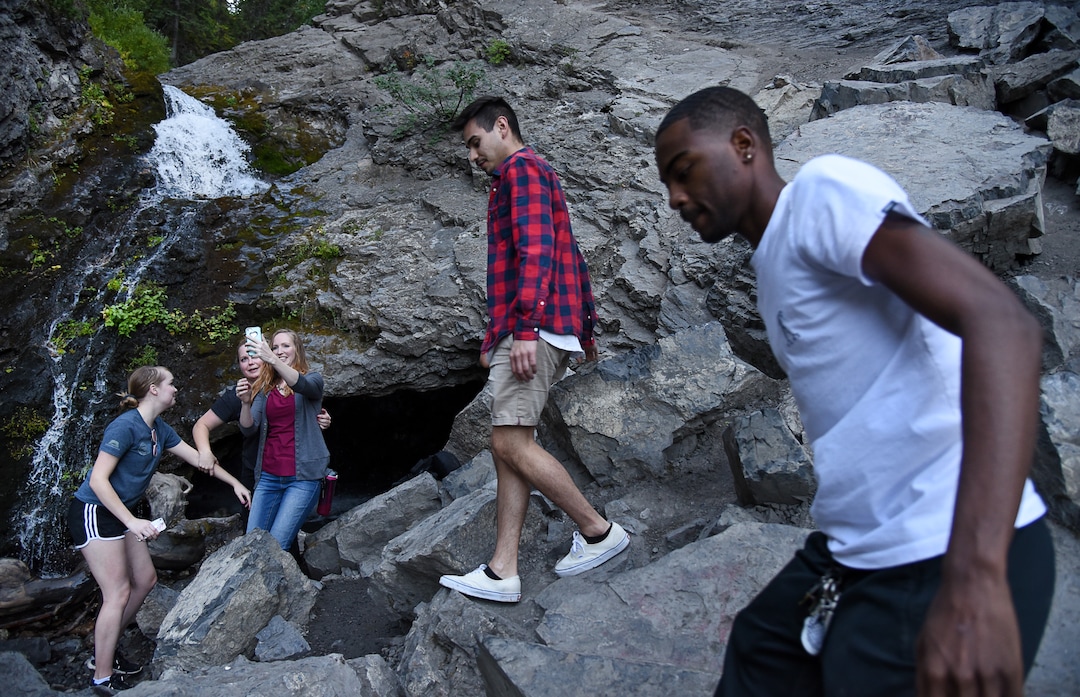 (Francisco Kjolseth  |  The Salt Lake Tribune)  The popular Donut Falls in Big Cottonwood Canyon draws the crowds on Friday, Aug. 31, 2018.