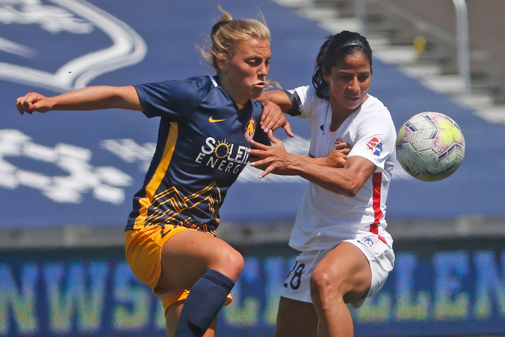(Rick Bowmer | AP) Utah Royals FC defender Madeline Nolf, left, battles with OL Reign midfielder Shirley Cruz, right, during the first half of an NWSL Challenge Cup soccer match at Zions Bank Stadium Wednesday, July 8, 2020, in Herriman.