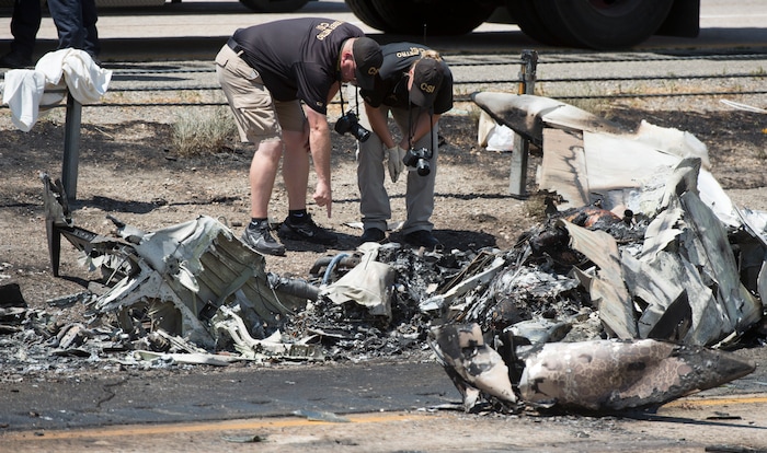 Rick Egan  |  The Salt Lake Tribune

CSI investigators sort through the debris from the plane crash that killed four people in the median of I-15 freeway, around 1:00pm. The crash closed the freeway to northbound traffic, Wednesday, July 26, 2017.


