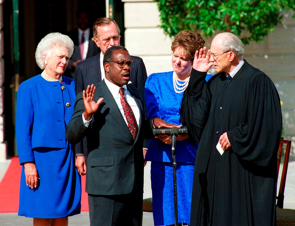 In this Oct. 18, 1991, photo, Clarence Thomas is sworn in to the Supreme Court in Washington, by Justice Byron White. Watch from left are first lady Barbara Bush, President George H.W. Bush, behind Thomas, and Thomas' wife, Virginia Lamp Thomas. (AP Photo)