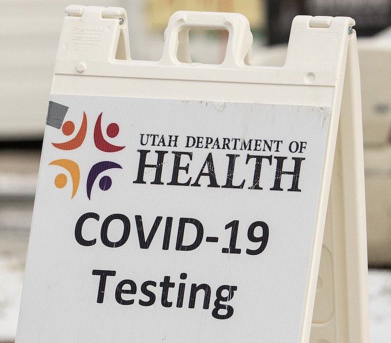 (Leah Hogsten | The Salt Lake Tribune)  People wait in their cars to be tested for Covid19 at the testing site in the parking lot of the Utah Public Health Laboratory building in Taylorsville Dec. 30, 2021. 