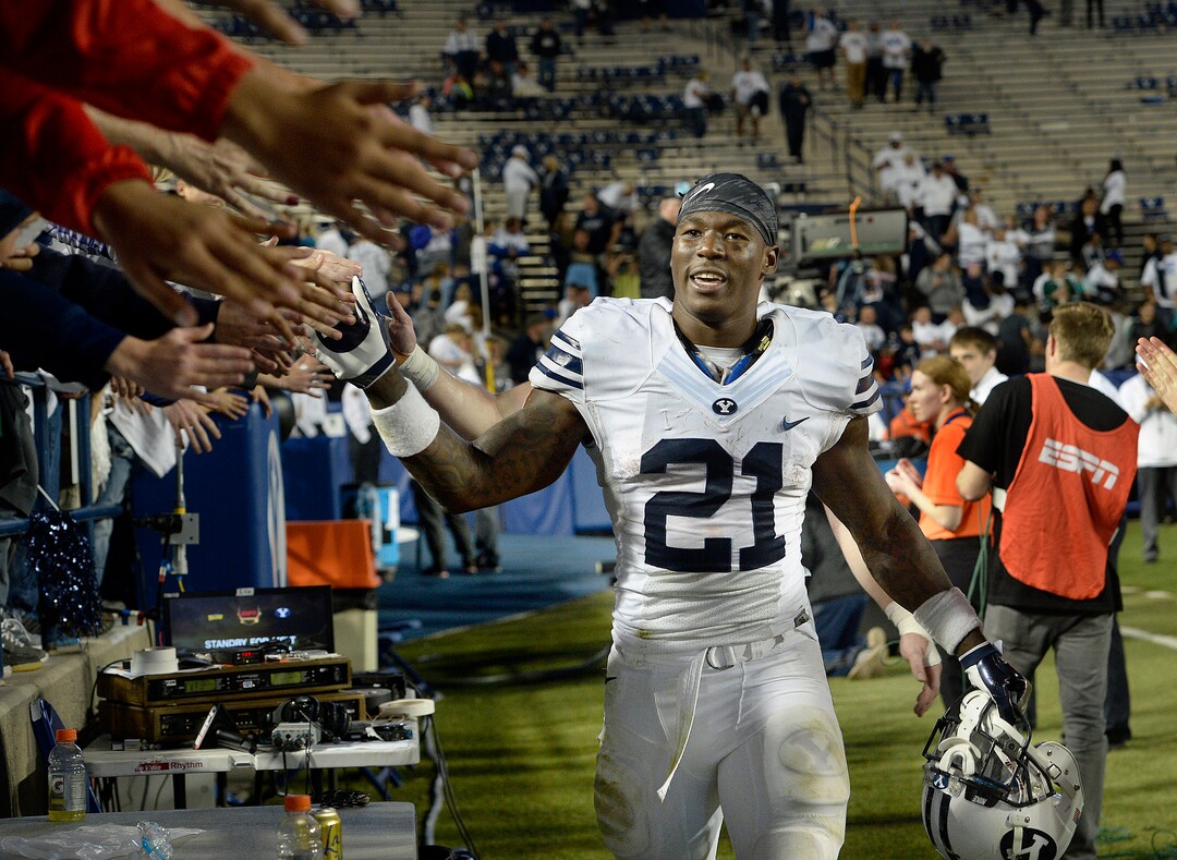 Scott Sommerdorf   |  The Salt Lake Tribune  BYU RB Jamaal Williams (21) celebrates with fans after  BYU defeated Toledo 55-53, Friday, September 30, 2016. 