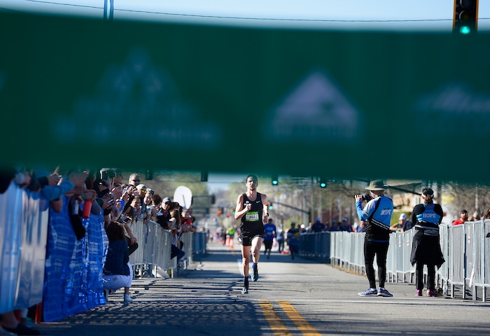 (Scott Sommerdorf | The Salt Lake Tribune)Travis Fuller of Provo, runs to the finishing tape as he wins the Salt Lake City marathon with a time of 2:27:53.03, Saturday, April 21, 2018.