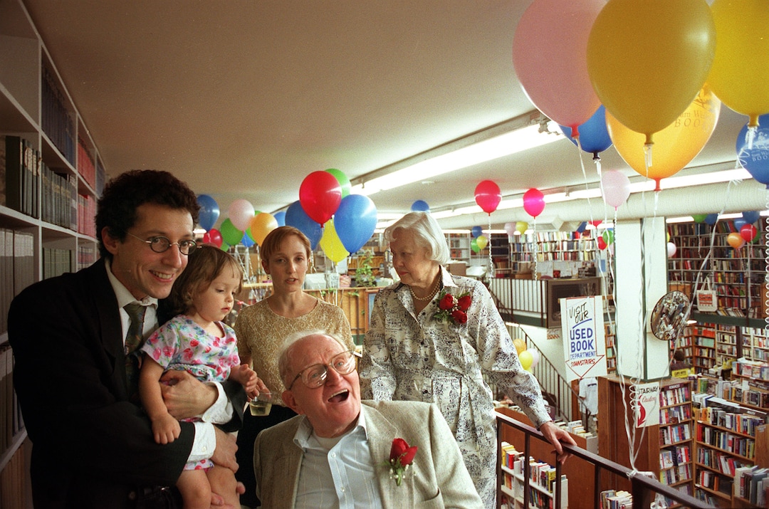 (Tribune file photo) Sam Weller, center, celebrates the 70th anniversary of the Weller bookstore at a party with, from left, son Tony Weller, granddaughter Lila Ann, daughter-in-law Catherine, and wife Lila in 1999.