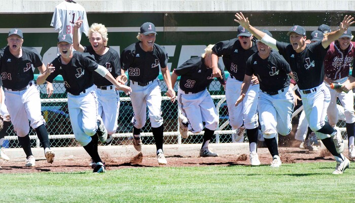 (Rick Egan  |  The Salt Lake Tribune)   Jordan High celebrates their 11-1 win over Olympus, for the 5A state baseball championship, at UVU in Orem, Friday, May 25, 2018.