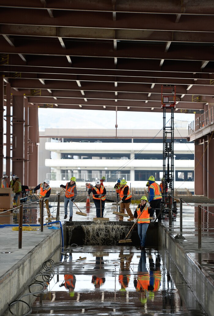 (Francisco Kjolseth  |  The Salt Lake Tribune)  The Salt Lake City Department of Airports gives a tour of the progress being made to replace the three aging terminals with a single central terminal building as crews remove standing water. Over time, the existing terminal, parking garage and concourses will be completely demolished and replaced with an estimated completion date of 2025.