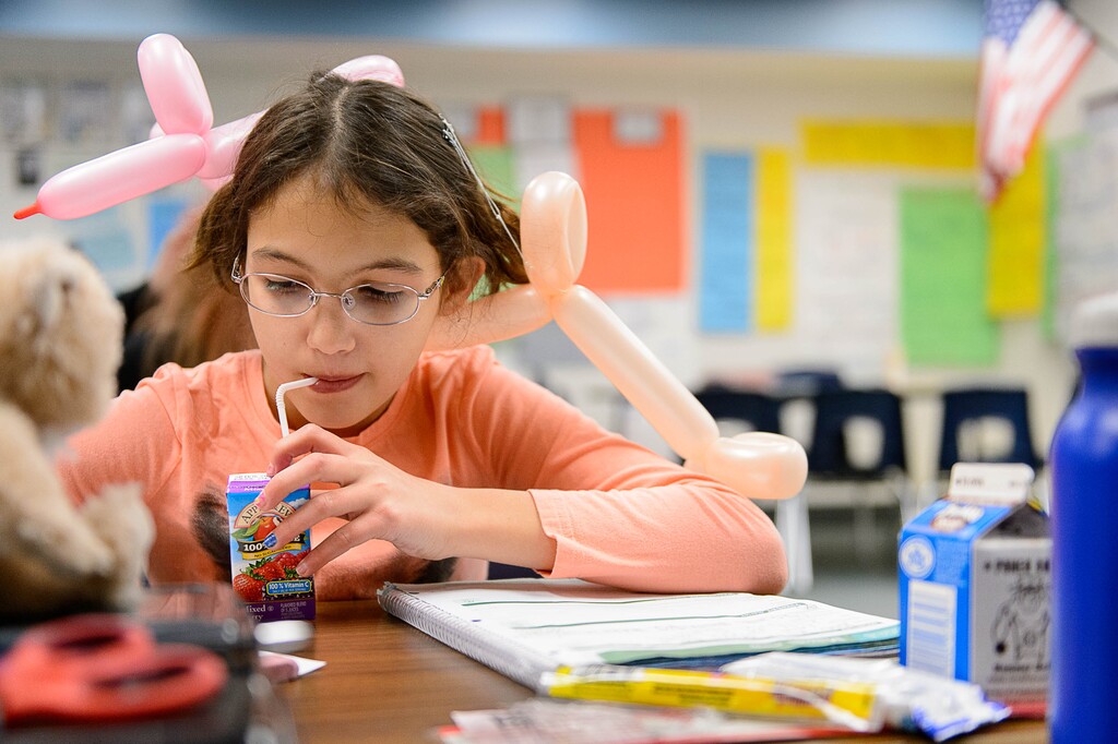 (Trent Nelson | The Salt Lake Tribune file photo ) A student sips from a juice box at Copperview Elementary in Midvale in 2015. The school launched a breakfast program for students so don't have to be hungry during the day.