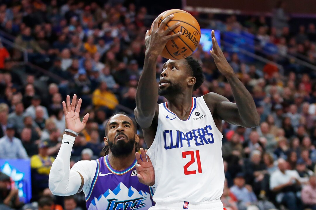 (Rick Bowmer | AP) Los Angeles Clippers guard Patrick Beverley (21) lays the ball up as Utah Jazz guard Mike Conley, rear, defends in the first half of an NBA basketball game Wednesday, Oct. 30, 2019, in Salt Lake City.