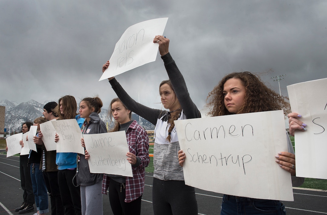 Scott Sommerdorf | The Salt Lake Tribune
Tailyn Bradford holds up a sign with the name Aaron Fels, one of the names of the 17 students and staff killed at Marjory Stoneman Douglas High School, during their walkout at Brighton High School, Wednesday, March 14, 2018.