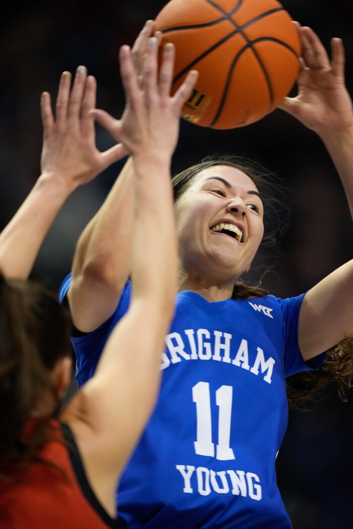 (Francisco Kjolseth | The Salt Lake Tribune) BYU Cougars guard Kaylee Smiler (11) pulls in a rebound in basketball action between the Utah Utes and the Brigham Young Cougars, at the Marriott Center in Provo, on Saturday, Dec. 10, 2022.