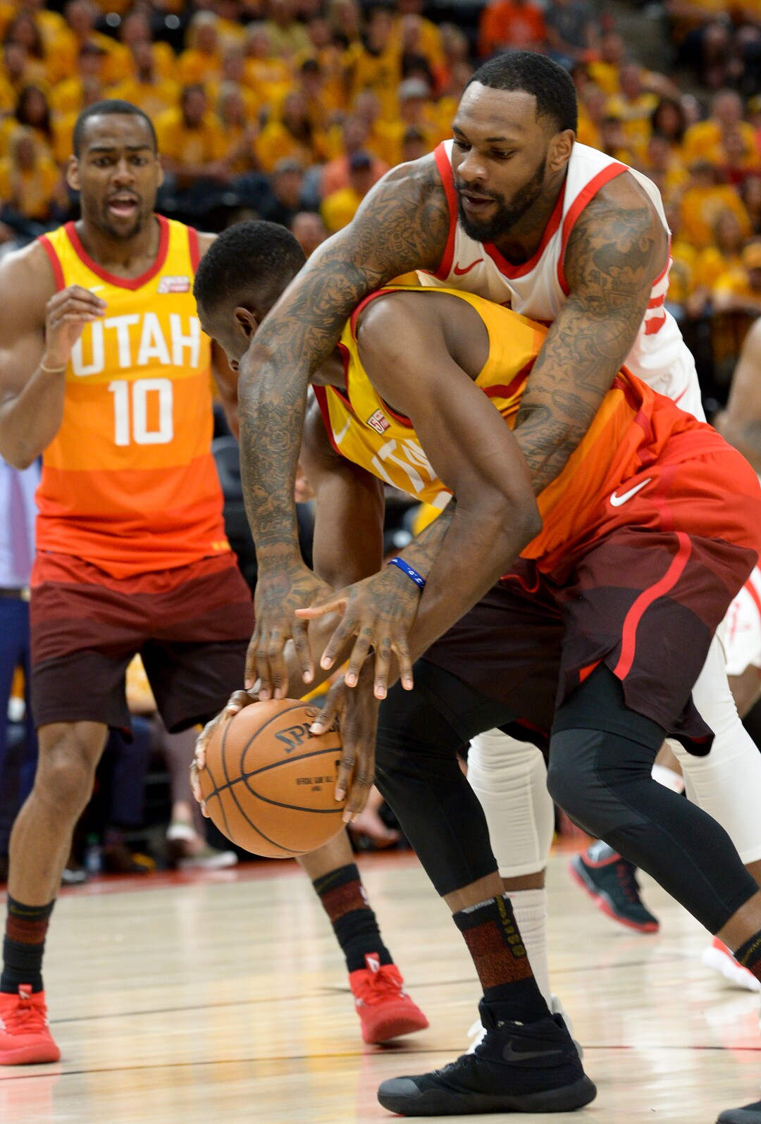 (Leah Hogsten  |  The Salt Lake Tribune)  Houston Rockets forward Tarik Black (28) fouls Utah Jazz center Ekpe Udoh (33).  The Houston Rockets defeated the Utah Jazz 113-92 in Game 3 of an NBA basketball second-round playoff series Friday, May 4, 2018 in Salt Lake City.