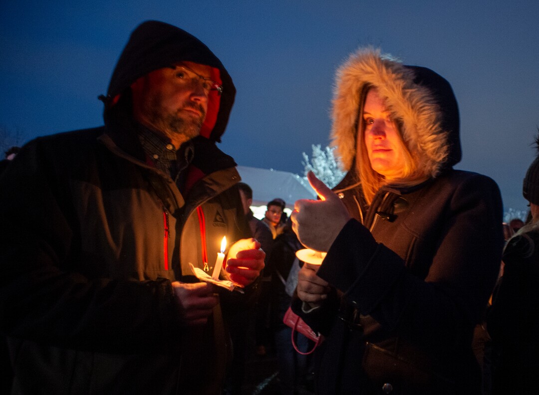 (Rick Egan  |  The Salt Lake Tribune)      Tim and Kim McCann, from Alpine, hold candles during a candlelight vigil for David Stokoe, a real estate agent killed at one of his rentals last week. Monday, Jan. 21, 2019.