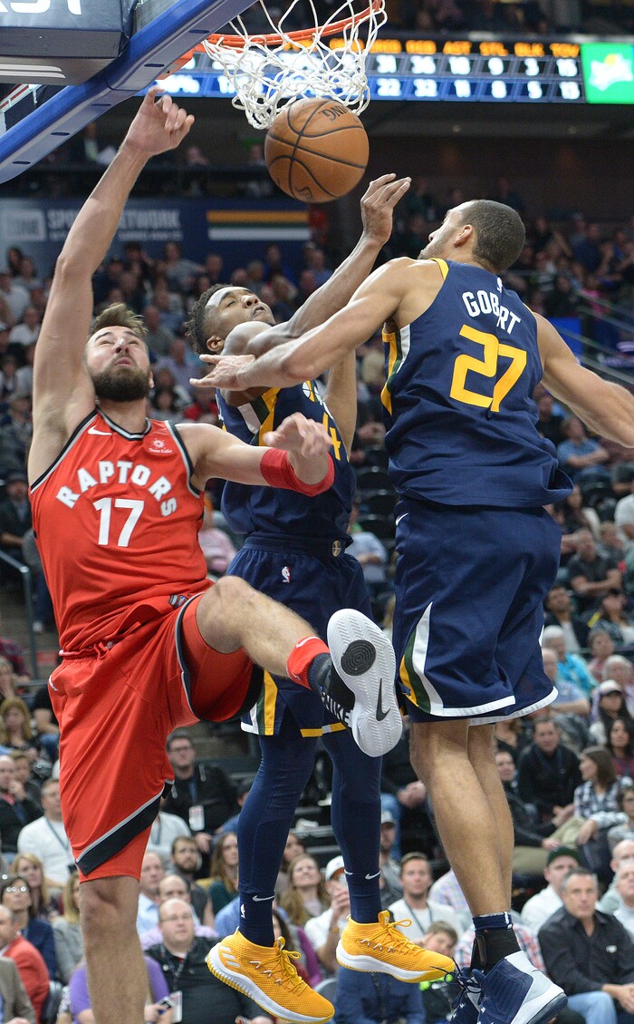 (Leah Hogsten  |  The Salt Lake Tribune) Toronto Raptors center Jonas Valanciunas (17) loses control of the ball under the net trying to break through Utah Jazz center Rudy Gobert (27) and Utah Jazz guard Donovan Mitchell (45).The Utah Jazz were defeated by the Toronto Raptors 100-109 at Vivint Smart Home Arena, Friday, November 3, 2017