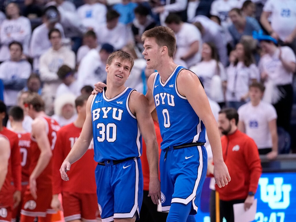 (Leah Hogsten | The Salt Lake Tribune) Brigham Young Cougars guard Dallin Hall (30) and Brigham Young Cougars forward Noah Waterman (0) walk off the court during a timeout as Brigham Young University hosts University of Utah in Provo, Dec. 17, 2022. 