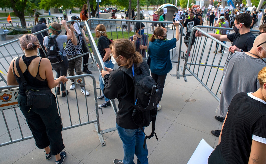 (Rick Egan  |  The Salt Lake Tribune)    Protesters dismantle the barricades, at the Salt Lake Public Safety Building, during a Justice for Bernardo protest on Wednesday, June 24, 2020.