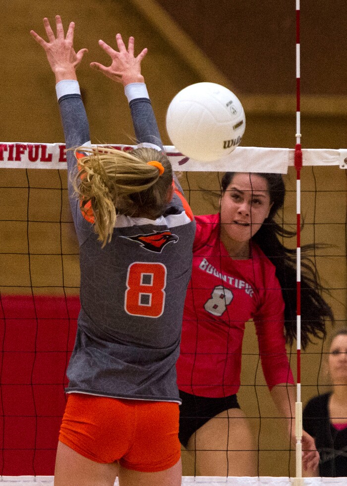 (Rick Egan  |  The Salt Lake Tribune)  Kaybrie Pe'a (8) hits the ball for Bountiful, as Kaitlyn Standifird (8) Skyridge, defends, in volleyball action, Bountiful vs. Skyridge, at Bountiful High, Wednesday, September 6, 2017.