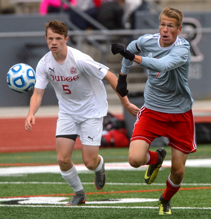 (Steve Griffin  |  The Salt Lake Tribune) Judge's Elliot Gleich, left, chases Delta's Tanner Gonnder during the  Class 3A boys' soccer state semifinal at Alta High School in Sandy Friday May 11, 2018.