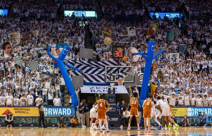 (Rick Egan | The Salt Lake Tribune) Brigham Young Cougars fans tru to distract Texas Longhorns forward Dillon Mitchell (23) as he shoots a free throw, in basketball action between the Brigham Young Cougars and the Texas Longhorns, at the Marriott Center, on Saturday, Jan. 27, 2024.

