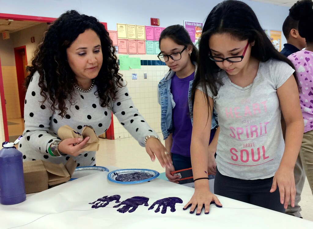 (AP Photo/Pat Eaton-Robb)

In this Feb. 14, 2017, photo, Nelba Marquez-Greene, left, helps 10-year-old Araceli Buchko put her hand print inside a giant paper heart as part of the Love Win's campaign's Friendship Day, a social and emotional learning activity at the Chamberlain Elementary School in New Britain, Conn. Marquez-Greene's Ana Grace Project works with elementary schools in New Britain to teach empathy, combat bullying and help socially isolated children.