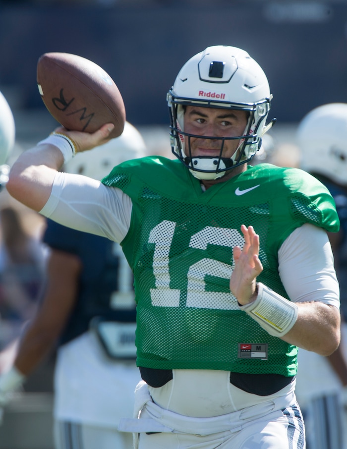 (Rick Egan  |  The Salt Lake Tribune) BYU quarterback, Tanner Mangum (12) runs the offense, during the BYU Cougars public scrimmage at Lavell Edwards Stadium, Thursday, August 17, 2017.