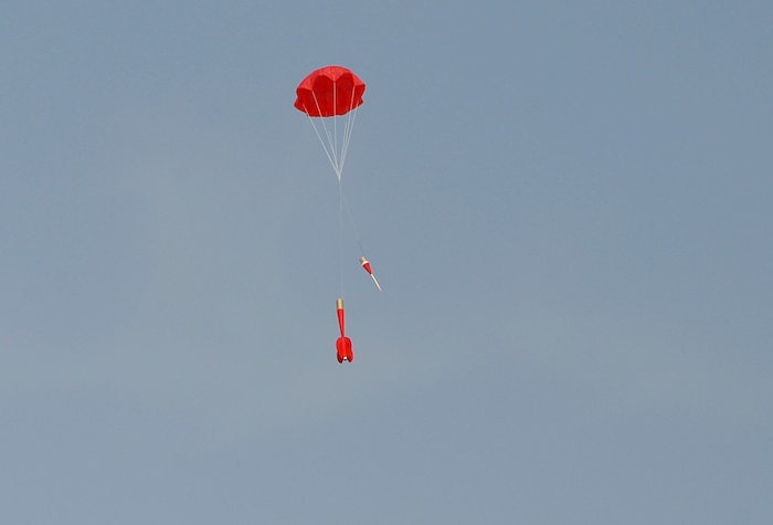 (Scott Sommerdorf   |  The Salt Lake Tribune)   A rocket is brought back down to Earth with a successful parachute deployment at "HellFire" — the event sponsored by the Utah Rocket Club on Saturday, Aug. 5, 2017.
