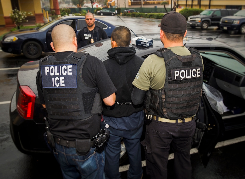 FILE - In this Tuesday, Feb. 7, 2017, photo released by U.S. Immigration and Customs Enforcement, foreign nationals are arrested during a targeted enforcement operation conducted by U.S. Immigration and Customs Enforcement (ICE) aimed at immigration fugitives, re-entrants and at-large criminal aliens in Los Angeles. A federal appeals court has given the Trump administration a rare legal win in its efforts to crack down on sanctuary cities. In a 2-1 decision Friday, July 12, 2019, the 9th U.S. Circuit Court of Appeals said the Justice Department was within its rights to give priority status for multimillion-dollar community policing grants to departments that agree to cooperate with immigration officials. (Charles Reed/U.S. Immigration and Customs Enforcement via AP, File)