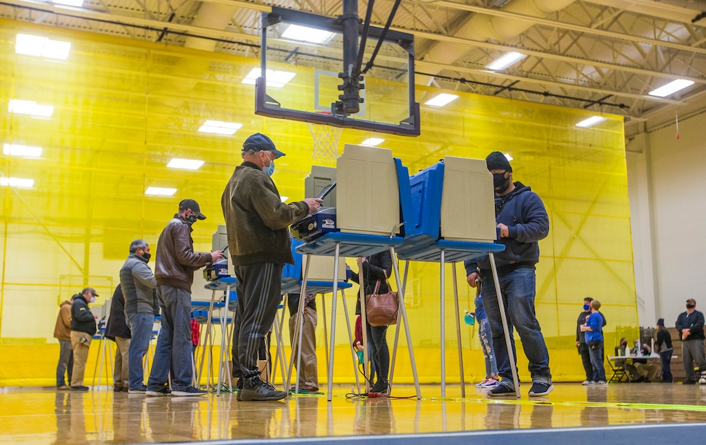 (Robert Franklin | South Bend Tribune file photo via AP) People cast their ballots on Election Day at Clay High School in South Bend, Ind., on Tuesday, Nov. 3, 2020.