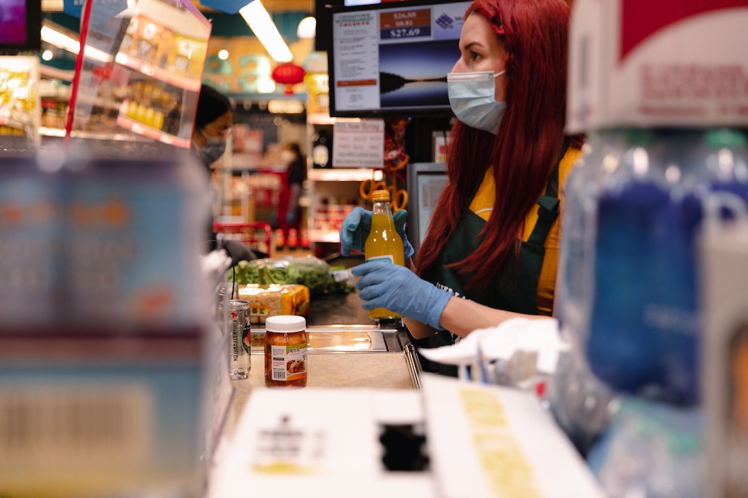 (Rachel Rydalch | The Salt Lake Tribune) A grocery store clerk scans a customers items at the Chinatown Supermarket on State Street in South Salt Lake, Wednesday, March 2, 2022. 