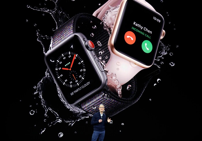 Apple CEO Tim Cook, shows new Apple Watch Series 3 product at the Steve Jobs Theater on the new Apple campus on Tuesday, Sept. 12, 2017, in Cupertino, Calif. (AP Photo/Marcio Jose Sanchez)