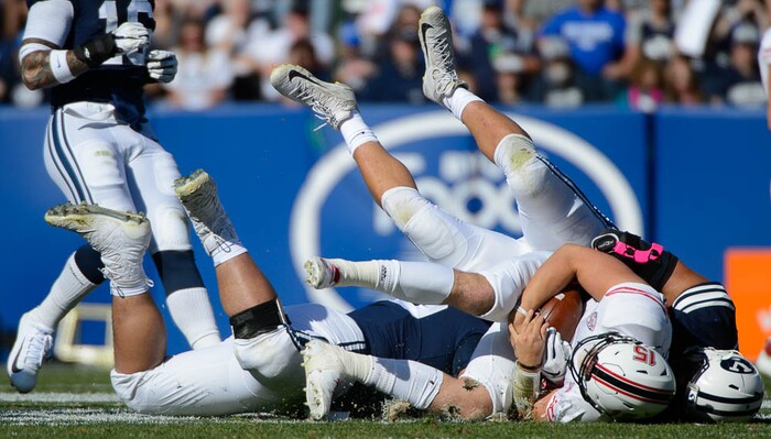 (Trent Nelson | The Salt Lake Tribune)  
Brigham Young Cougars defensive lineman Corbin Kaufusi (90) sacks Northern Illinois Huskies wide receiver Cole Tucker (18) as BYU hosts Northern Illinois, NCAA football in Provo, Saturday Oct. 27, 2018.