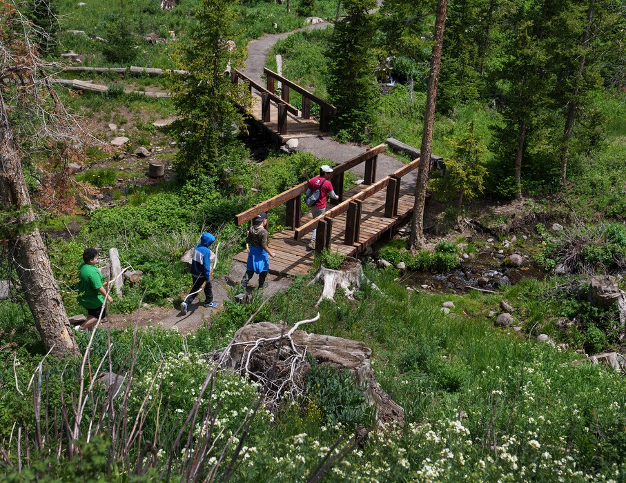 (Leah Hogsten | The Salt Lake Tribune) Campers head for the archery lawn during their weeklong stay at Camp Hope, one of two programs sponsored by Salt Lake area law enforcement agencies that hope to “connect with the kids before correcting them,” on Thursday, June 30, 2022.