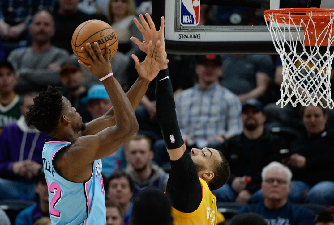 (Francisco Kjolseth  |  The Salt Lake Tribune) Miami Heat forward Jimmy Butler (22) tries to get past Utah Jazz center Rudy Gobert (27) as the Utah Jazz host the Miami Heat in their NBA basketball game at Vivint Smart Home Arena in Salt Lake City on Wednesday, Feb. 12, 2020.