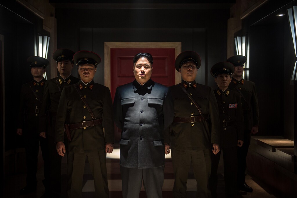 This photo provided by Columbia Pictures - Sony shows, Randall Park, center, as North Korean leader Kim Jong Un in Columbia Pictures' "The Interview." North Korea has been linked to the unprecedented act of cyberwarfare against Sony Pictures that exposed tens of thousands of sensitive documents and escalated to threats of terrorist attacks that ultimately drove the studio to cancel all release plans for "The Interview." (AP Photo/Columbia Pictures - Sony, Ed Araquel)