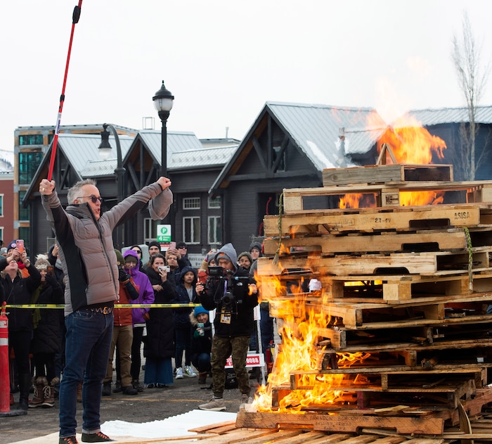 (Rick Egan  |  The Salt Lake Tribune)      John Cooper, the festival's director, lights the first-ever Sundance bonfire, a community gathering on Swede Alley, in Park City, Thursday, Jan. 30, 2020.