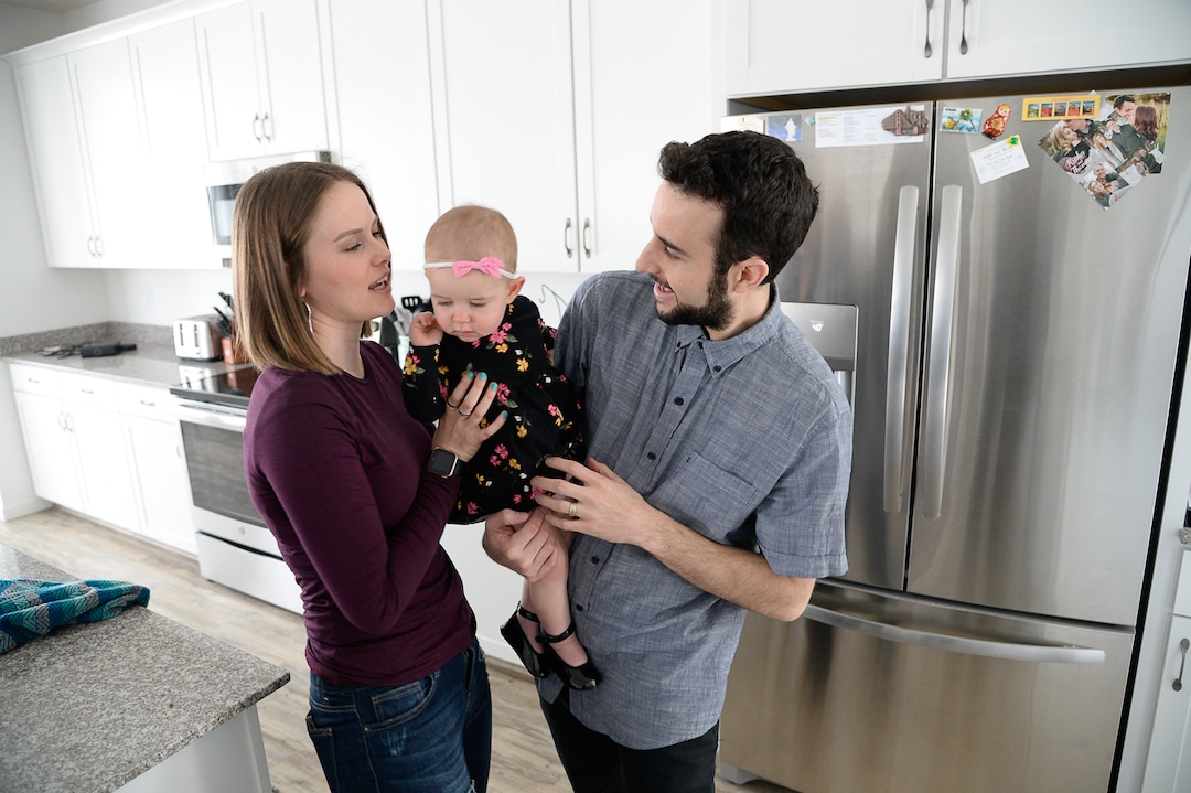 (Francisco Kjolseth  |  The Salt Lake Tribune)  Ember and Jeremy Ulrich spend time with their daughter Jemma, 1, at their home in Lehi after moving from Pleasant Grove last October because they could get more house for their money there, and it's closer to Jeremy's job at Adobe in Lehi.