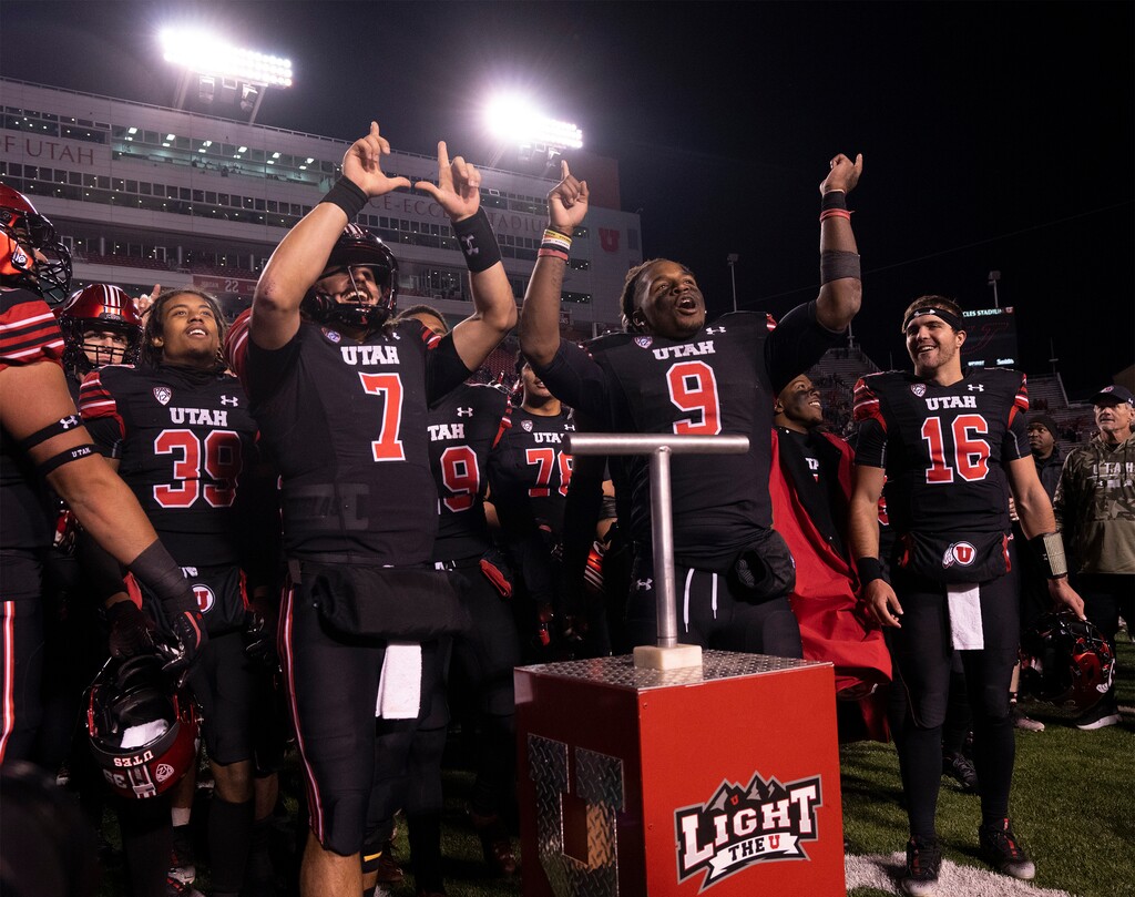 (Rick Egan | The Salt Lake Tribune) Utah Utes quarterback Cameron Rising (7) and Utah Utes running back Tavion Thomas (9), sing the fight song with the team after lighting the U, as the Ute's defeated  the Stanford Cardinals, 42-7, in PAC-12 football action at Rice-Eccles Stadium, on Saturday, Nov. 12, 2022.