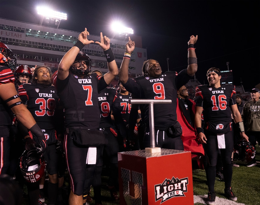 (Rick Egan | The Salt Lake Tribune) Utah Utes quarterback Cameron Rising (7) and Utah Utes running back Tavion Thomas (9), sing the fight song with the team after lighting the U, as the Ute's defeated  the Stanford Cardinals, 42-7, in PAC-12 football action at Rice-Eccles Stadium, on Saturday, Nov. 12, 2022.