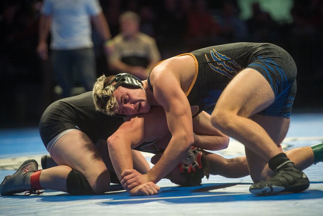 (Rick Egan  |  The Salt Lake Tribune)   Cooper Legas (Orem) wrestles Byron Anderson (DESERT HILLS) in the 195 weight class.  Legas won the match (Dec 7-5) in the 4A State Wrestling at UVU in Orem, Saturday, February 10, 2018.